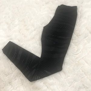 Gently used Nike XSmall black reflective design leggings